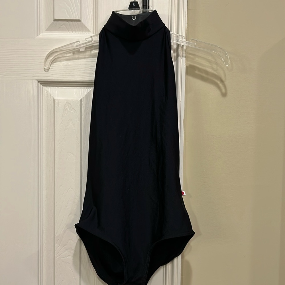 Yumiko women’s medium high neck black leotard. Pretty open back, bust lining.